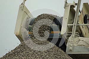 Crushed stone strew in rubble mound photo