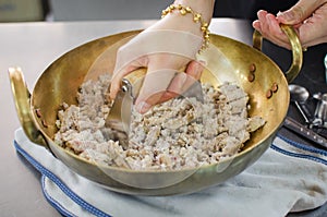 Crushed taro in brass pan prepare for making thai dessert