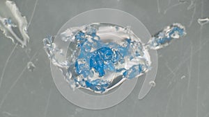 Crushing and agglomeration of plastic particles on water surface photo