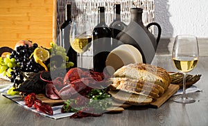 Crustaceans with smoked sturgeon and wine on background with wicker panel