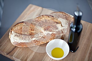 Crusty bread on bread board