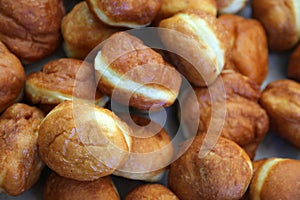 Crusty carnival donuts fried in oil on new years event photo