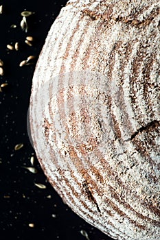 Crusty sourdough artisan bread on dark background