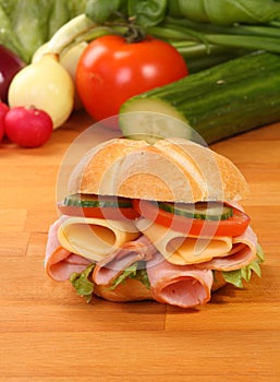 Crusty white roll filled with ham and salad