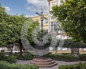 Cruz de la Cerrajeria, the Locksmith Cross, located in Plaza Santa Cruz in Seville, Spain. photo