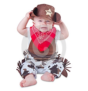 Crying baby in cowboy outfit