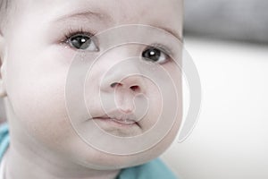 Crying baby 6 7 months, portrait close-up. Sad face of a child with tears in his eyes, baby tears girl kid boy baby