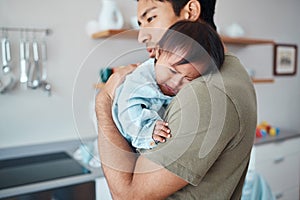 Crying, down syndrome baby and father holding, comforting and consoling upset child in their home with a caring parent