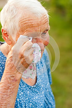 Crying elderly woman