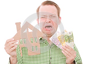 Crying houseowner with money