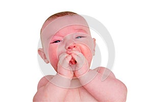 Crying Infant baby boy at the age of four months, close-up portrait, isol