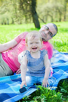 Crying little baby girl with her father