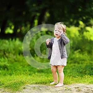 Crying little child in a park