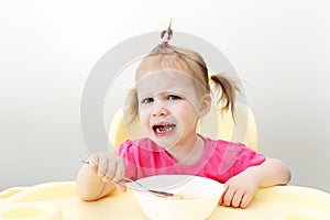 Crying little girl dont want to eat soup