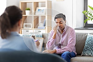 Crying man at psychotherapy session