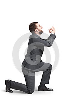 Crying man standing on one knee