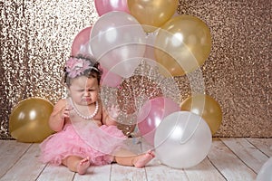 Crying One Year Old Baby Girl with Balloons