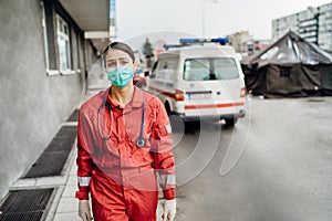 Crying paramedic in front of isolation hospital facility.Mental melt down of medical professional.Emergency room doctor in fear