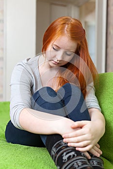 Crying red-headed lonely teenager girl