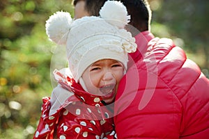 Crying sad girl with funny hat