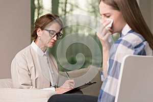 Crying teenager with probation officer photo