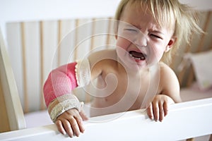 Crying Toddler With Arm In Cast