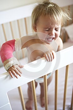 Crying Toddler With Arm In Cast