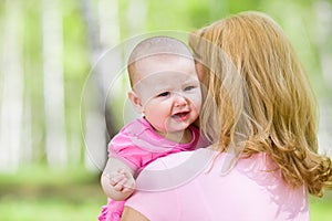 Crying or upset girl with mother outdoor