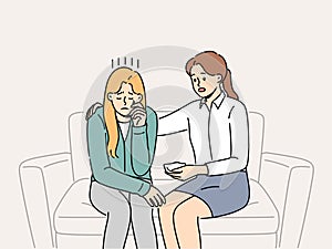 Crying woman at reception of psychologist consoling patient sitting on couch and experiencing stress