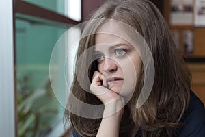 Crying young caucasian woman girl looks sad, depressed, upset or unhappy