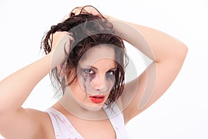 Crying young woman with flowed mascara