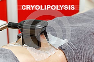 Cryolipolysis freeze fat procedure in cosmetic salon, belly close-up