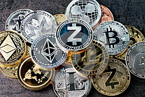 Crypto currency background with various of shiny silver and golden physical cryptocurrencies symbol coins, Bitcoin, Ethereum,