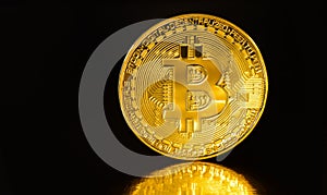 Crypto currency Golden Bitcoins isolated on black background . Photo virtual money.Blockchain technology, bitcoin mining concept