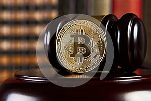 Crypto currency law, judge gavel, stacked legal book and bitcoin