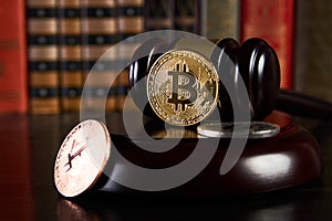 Crypto currency law, judge gavel, stacked legal book and bitcoin