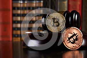 Crypto currency law, judge gavel, stacked legal book and bitcoin