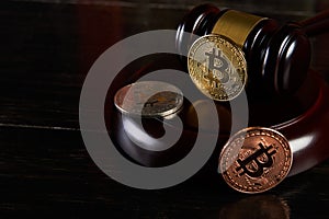 Crypto currency law, judge gavel, stacked legal book and bitcoin