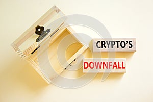 Crypto downfall symbol. Concept words Cryptos downfall on wooden blocks. Beautiful white table white background. Wooden empthy