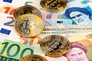 Cryptocurrency Bitcoin coins virtual money with Euro and Iranian Rial money photo