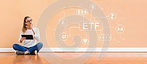 Cryptocurrency ETF theme with woman using a tablet