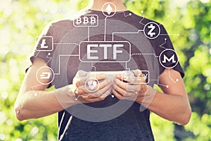 Cryptocurrency ETF theme with young man holding his smartphone
