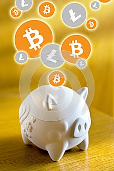 Cryptocurrency - financial technology and internet money - piggy bank and coin sign of Litecoin LTC and Bitcoin BTC