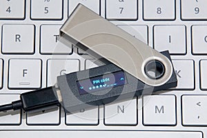 Cryptocurrency Hardware Wallet On Laptop Keyboard