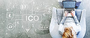 Cryptocurrency ICO theme with man using a laptop