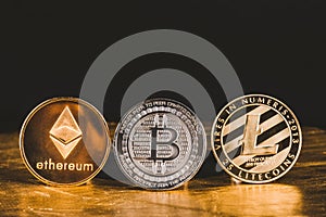 Cryptocurrency litecoin,Silver Bitcoin,Ethereum on golden floor