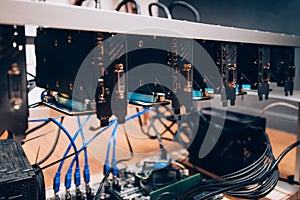 Cryptocurrency mining rig, creating bitcoin. Details of graphics cards in modern industry