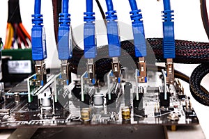 Cryptocurrency mining rig PCIe riser extenders plugged to mother