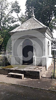 Crypts in the cemetery are old photo