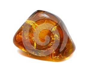 crystal of a amber on a white surface